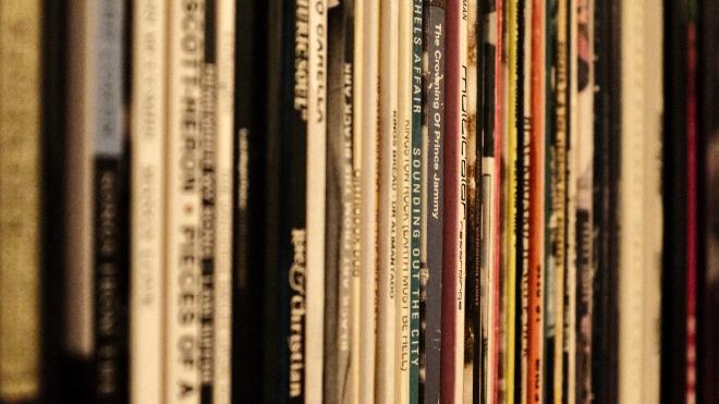 Record spines on a shelf
